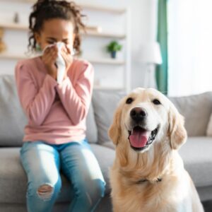 little girl with allergies next to dog